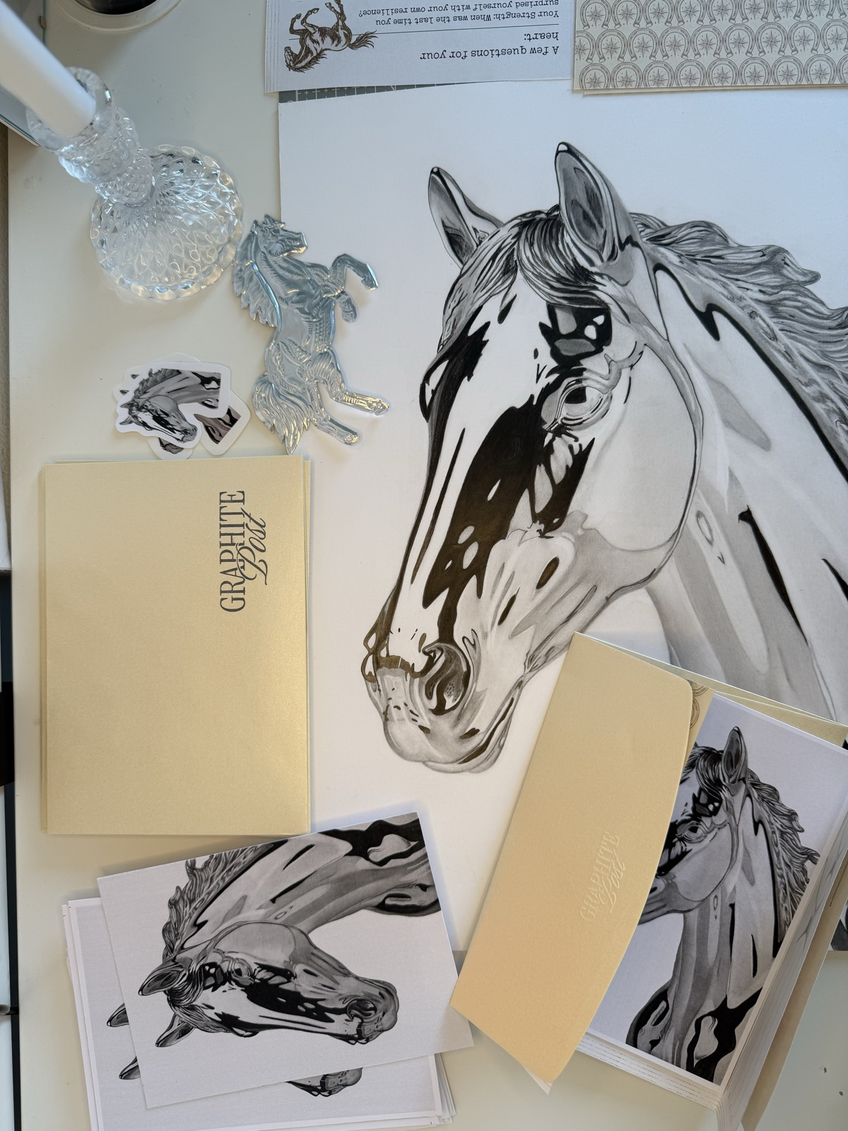 Finishing fine details on a pencil drawing — the final stage of the artistic process