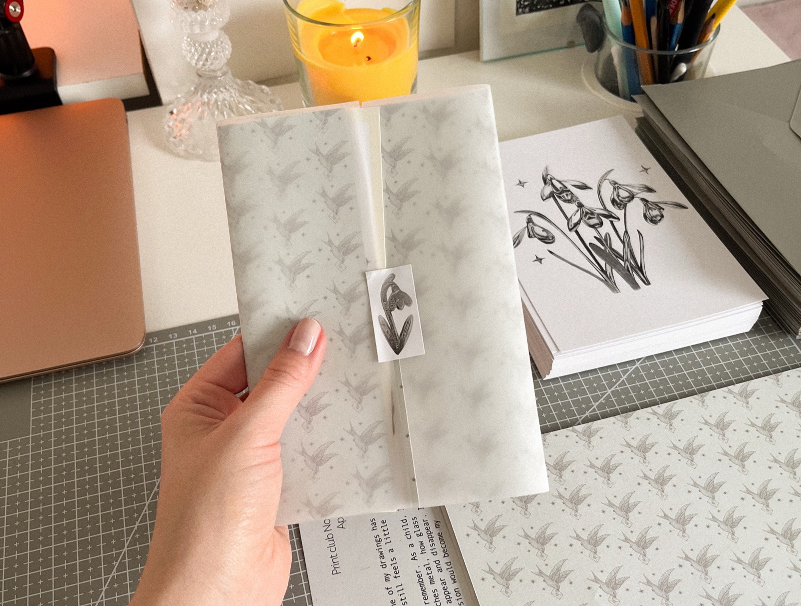 Hand holding a wrapped Graphite Post package